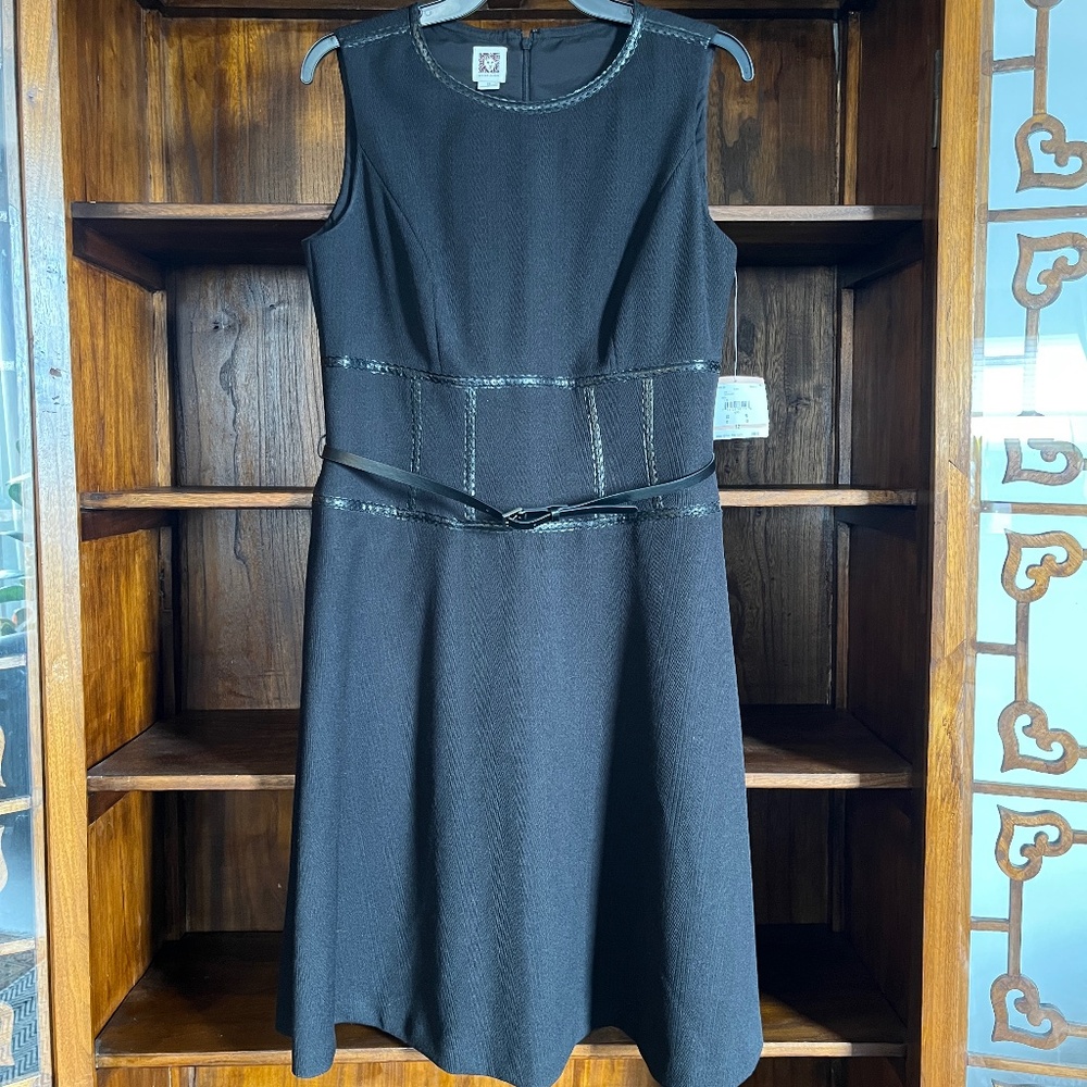 Anne Klein (12/L) black sleeveless shift dress with tailored waist & pockets.